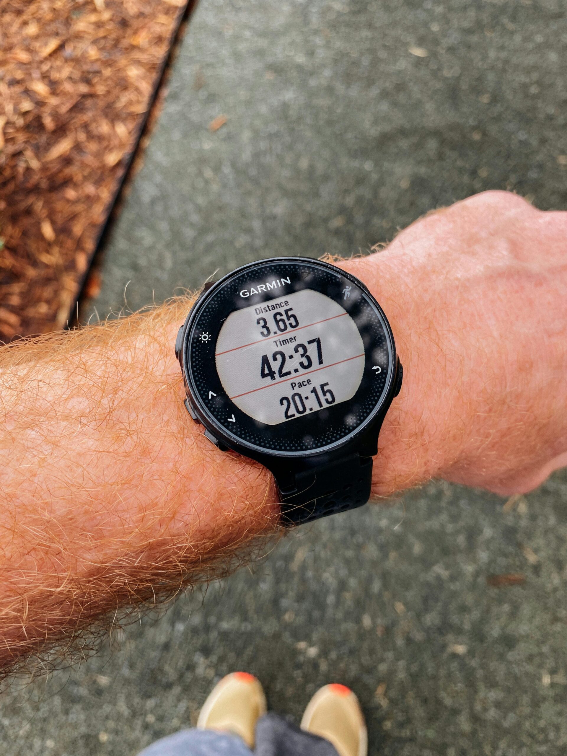 Runner checking GPS watch during marathon training