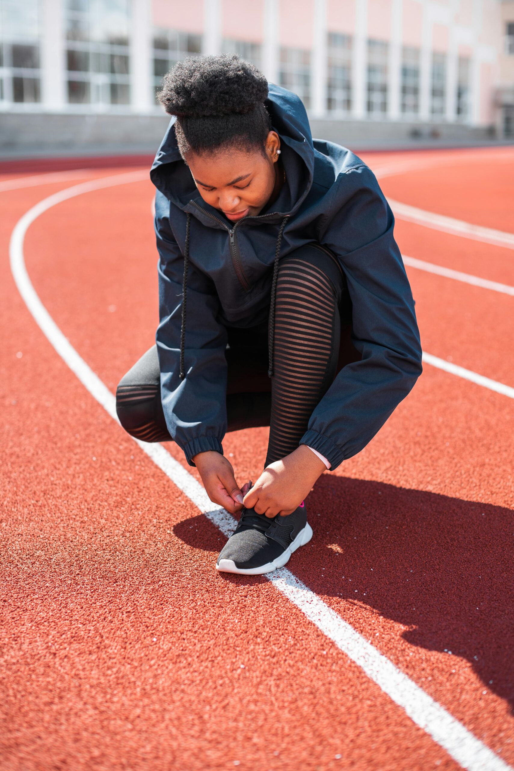 Runner tying running shoes before a training run